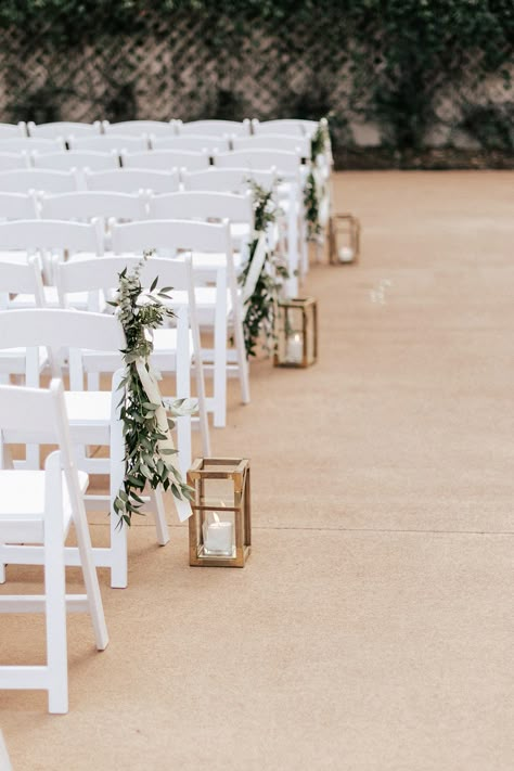 Simple Wedding Walkway Decor, Ceremony Aisle Greenery, Green And White Aisle Decor, Isle Chair Decorations Wedding, Patio Ceremony Wedding, Greenery Wedding Aisle Decor, Ceremony Aisle Decor Outdoor Simple, Isle Way Wedding Decor, Coastal Wedding Ceremony Decor