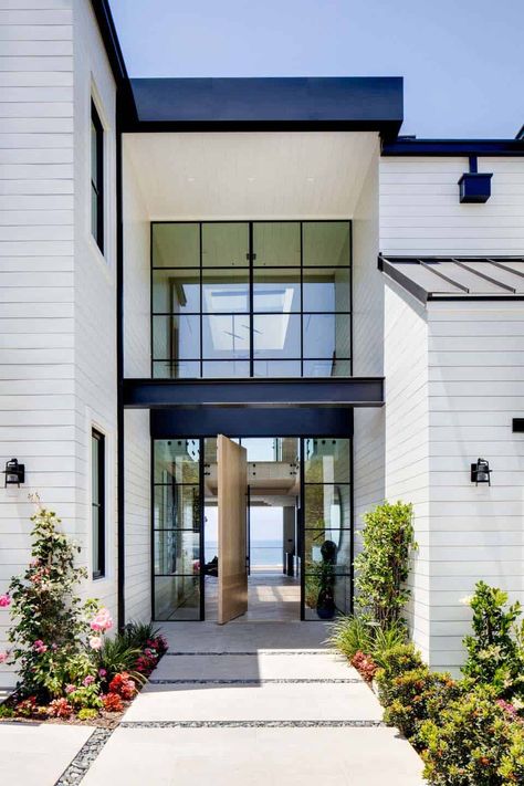 Coastal contemporary home with indoor/outdoor living in Southern California Brandon Architects, Coastal Exterior, Beach House Exterior, Traditional Cottage, Coastal Contemporary, Brick Veneer, Coastal Modern, Pivot Doors, House Architecture