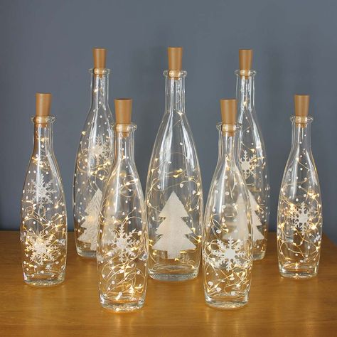 Diy Christmas Bottles Decor, Lights In Bottles Diy, Christmas Bottle Decorations, Wine Bottle Christmas Craft, Christmas Crafts With Wine Bottles, Upcycle Glass Bottles Diy Crafts, Glass Bottles Christmas Decor, Glass Bottles Art Christmas, Xmas Bottle Art