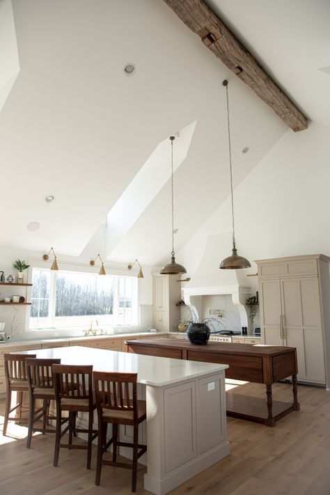 Kitchen with natural light streaming through the dormers, and 10 foot kitchen window.  Tall, vaulted, cathedral ceilings with 150 year old barn beam.  Large brass pendants hanging.  Double kitchen islands, one quartz and the other a walnut wood bakers table. 4 Chair Kitchen Island, Two Islands Kitchen, Large Island With Table Attached, Kitchen With 2 Entrances, Large White Island Kitchen, Kitchen Remodel Double Island, Double Counter Kitchen Island, Off Center Kitchen Island, Two Islands In Kitchen