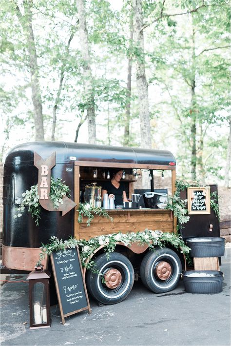 Anyone up for a stunning mobile bar? We love this greenery decor that adorns this black bar trailer from Single Barrel Events. Need to take wedding day drinks anywhere? A roaming bar is where it's at! This black and white wedding in the Smoky Mountains is also worth viewing. Photos from Leah Nicole Photo | The Magnolia Venue www.themagnoliavenue.com #mobileweddingbar #weddingdaydrinks Mobile Bar Cart, Mobile Cocktail Bar, Gerobak Dorong, Lovely Letter, Mobile Coffee Shop, Coffee Trailer, Caravan Makeover, Travel Bar, Smoky Mountain Wedding