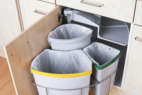 Need multiple trash bins? Have a deep or corner cabinet that’s underutilized? Have we got a find for you. It may be a little weird to geek out over a trash can setup, and yet that is what’s happening here. This compact, under-the-cabinet three-trash-bin setup is so smart! I’m just imagining standing over the bins: “And YOU, bottle, go here (plink!), and YOU, food scraps, go here (plop!), and YOU, old newspaper, go here (drop!). Now swing back under the cabinet! Blind Corner Cabinet Solutions, Kitchen Corner Ideas, Cozy Kitchen Ideas, Corner Cabinet Solutions, Corner Cabinet Organization, Blind Corner Cabinet, Corner Base Cabinet, Trash Can Cabinet, Corner Kitchen Cabinet