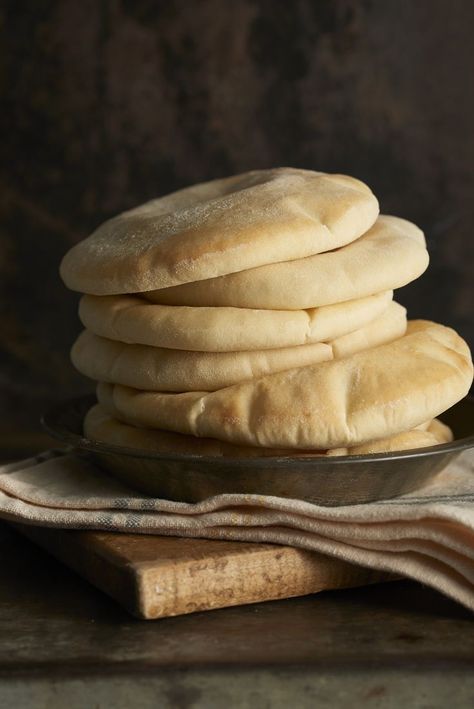 Pita bread is one of those things (like English muffins, like soft pretzels) that most people simply don't think of making. "It's too hard. It won't work. They won't puff up." Not true! This is just a simple white bread recipe cooked in an unusual way. They will puff up; honest. And fresh, golden pita bread, hot from the oven, is a revelation; it makes those packaged pitas pale (literally) by comparison. Fresh Pita Bread, Easy School Lunch Ideas, King Arthur Recipes, Pita Bread Recipe, Easy School Lunches, White Bread Recipe, School Lunch Ideas, English Muffins, Vegan Bread