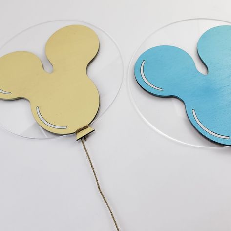 Want a playful touch to your kid's room? These Mickey Mouse Balloons are adorable and wo with any theme. They can be painted a different color for a uniform look throughout your room. Mounting them to the wall is easy with 3M strips, and they are available in multiple sizes to match your space perfectly. - Made of Baltic birch and Clear Acrylic or just Baltic birch - Hand Crafted in Pennsburg, PA - Lightweight and easily Mounts to the wall using 3M strips - Sold individually so you can get the p Mickey Themed Bedroom, Minimalist Disney Bedroom, Disney Theme Bathroom, Disneyland Room, Disneyland Themed Nursery, Up Disney Room, Disney Kids Room, Disney Themed Bedrooms Vintage, Disney Themed Wall