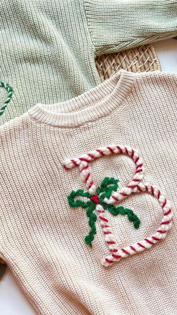 Stitchin With Samantha on Instagram: "DIY Bow Christmas Sweater!👇🎄  The cutest keepsake for the holidays - or matching family outfits for Christmas morning!!🥹  Comment BOW for the link to my YouTube tutorial, my DIY Kit, and all the supplies I used to make this!  Eeeeekk I can’t wait to put Olivia in this for the Christmas season!!🥹❤️  I had the fun idea to do the bow in greenery and I LOVE how it turned out!   #embroidery #handembroidery #christmas #christmascrafts #diyembroidery #embroideredsweater #babysweater #christmasgifts #momlife #momcrafts #handembroideryclothing #handembroideredclothes #handembroidered #diycrafts #holidaycrafts #diy" Bow Sweater Diy, Diy Bow Christmas, Christmas Sweater Embroidery, Embroidery Sweater Diy, Embroidered Christmas Sweater, Ugly Christmas Sweater Outfit, Diy Christmas Sweater, Christmas Sweater Outfits, Ugly Sweater Diy