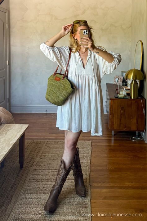 Found this super cute boho babydoll dress on Depop and styled it with my trustee brown leather cowboy boots and a raffia basket bag to go to a street festival. Loved the mesh of aesthetics. #springoutfitideas #festivaloutfitideas #coastalcowgirl #cowboybootsoutfit #raffiabag • how to style cowboy boots with a dress • how to style a babydoll dress • linen dress outfit ideas • Boho Dresses Casual, Cowboy Boots Boho Outfit, Styling Boots With Dresses, Cowboy Boot And Dress Outfit, Fall Outfit With Cowboy Boots, Brown Boots Outfit Summer, Cowboy Shoes Outfit, Short Dress And Boots Outfit, Cowboy Boots With Dress Outfit