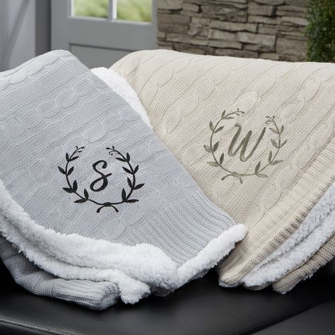 "Our Floral Wreath Personalized Throw Blanket has an incredibly, soft knitted sweater pattern on the front and an added bonus of sherpa on the reverse side. Medium weight that's not too heavy or too light makes it a cozy addition to your couch or sofa on a chilly evening.  - Embroidered with any name and choice of thread color - Cable knit front and sherpa on the reverse side - Measures 50\" W x 60\" L - Available in grey or tan - Face: 100% acrylic - Reverse: 100% polyester - Machine wash cold Tan Throw Blanket, Monogram Throw Blanket, Knitted Sweater Pattern, Monogram Blanket, Cable Knit Throw Blanket, Grey Throw Blanket, Custom Throw Blankets, Personalized Throw Blanket, Cable Knit Throw