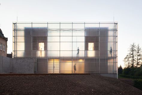 This constrained site led Stolín and Mičeková to develop the concept of breaking down the form of the building while keeping it unified by its outer skin.  "We want children to perceive and learn about architecture through various spatial configurations, which are implemented within the whole composition", they explained. Building Skin, Double Skin, Translucent Glass, Glass Facades, The Czech Republic, Chinese Architecture, Architecture Office, Zaha Hadid, Facade Architecture