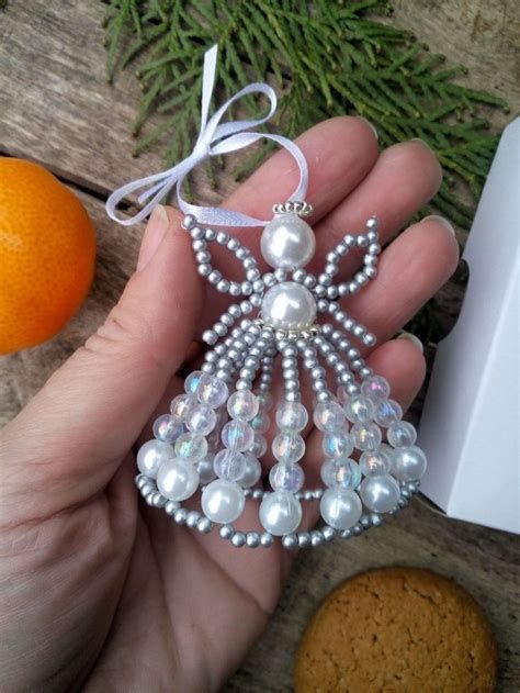 free patterns for beaded christmas ornament covers for c9 christmas lights - Yahoo Image Search Results Angel Tutorial, Angel Ornaments Diy, Diy Christmas Angel Ornaments, Beaded Ornaments Diy, Christmas Angel Crafts, Beaded Christmas Decorations, Diy Angels, Beaded Angels, Christmas Angel Ornaments