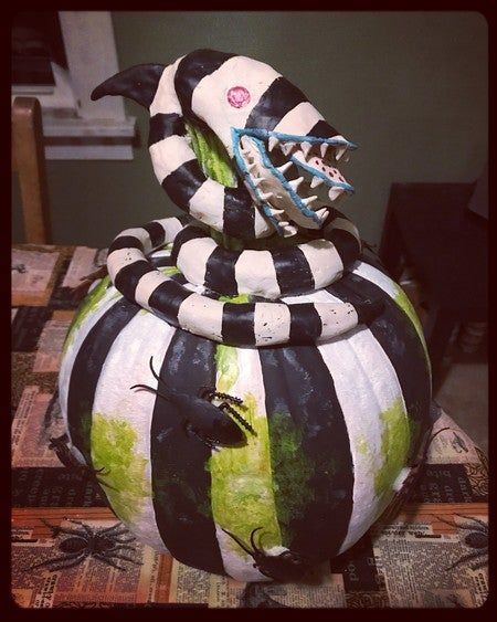 Pumpkin Carving Ideas For Competition, Halloween Pumpkins Painted Beetle Juice, Beetle Juice Pumpkin Decorating, Pumpkin Decorating Beetlejuice, Beatle Juice Pumpkin, Beetle Juice Pumpkin Painting Ideas, Diy Sand Snake Beetlejuice, Pumpkin Decorating Competition, Beetle Juice Painted Pumpkin