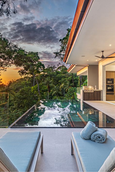 Two sun loungers at end of infinity swimming pool overlooking rainforest against yellow sunset sky. Costa Rica Villa, Costa Rica Villas, Costa Rica Retreat, Costa Rica Luxury, Watch The Sunset, Forest View, Dream Holiday, Ocean Views, Luxury Holidays