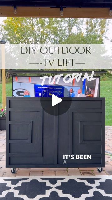 Nneka Mosley | DIY & Design + Lifestyle | PA on Instagram: "SAVE THIS POST! (Update- my building plan for this is available in my bio!). It’s been a year since I made this tv lift for my husband and we’ve definitely gotten great use out of it! We purchased a grill cover and used that to cover it when not in use.  We also brought in inside the house when it got really cold then brought it back out in spring.  So today I’m running this back because now is the perfect time to make one…just in time for football season.  This is really a very simple build.  It’s literally just a basic box..no fancy cuts although you can definitely add some miter cuts for a cleaner look.  The magic is in the tv lift mechanism that you buy, assemble then add to the box.  I used one of the mid range mechanisms (wi Outdoor Tv Cover Ideas, Tv Cabinet Diy, Outdoor Tv Box, Outdoor Tv Setup, Outdoor Tv Stand, Outdoor Tv Mount, Patio Tv, Tv Lift Mechanism, Outdoor Tv Enclosure