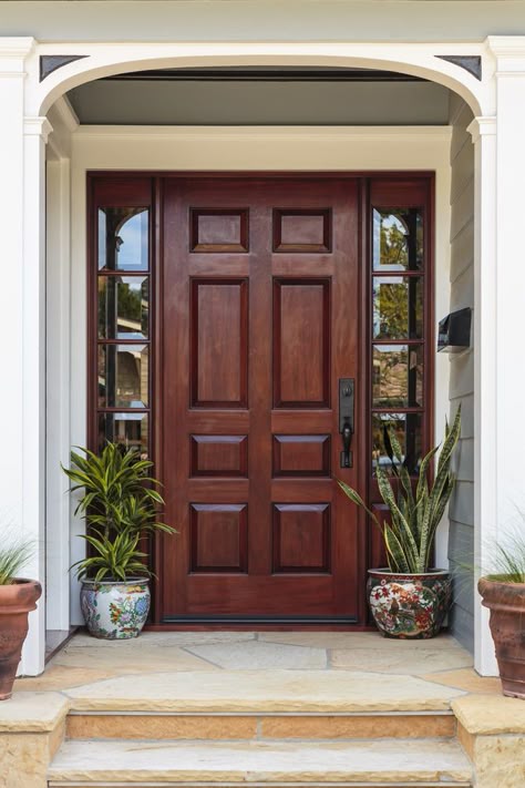 Flagstone entry stairs lead to this dark wood front door that's flanked by mirrored side panels. It is accented with a pair of hand painted ceramic pots. Wood Front Doors, Wooden Front Doors, Wooden Door Design, House Front Door, Main Door Design, Front Door Design, House Doors, Lhasa, Main Door