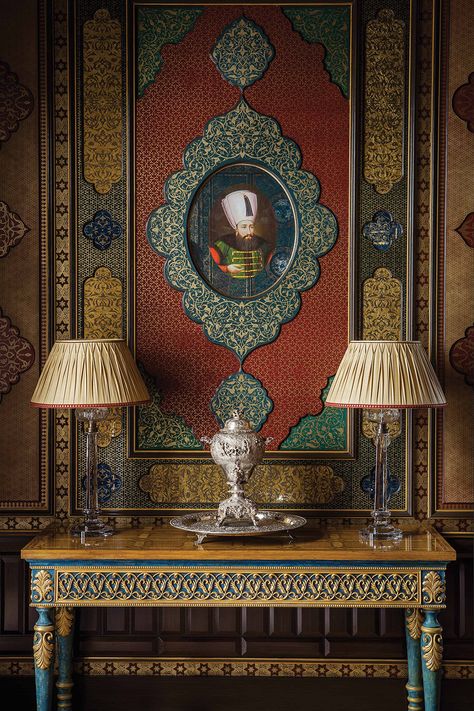 Here you can see how the hand-painted portrait of a Sultan has been surmounted by a blue vere eglomise frame that is surrounded by a hand-painted paper that is then edged with a painted and gilded molding. The nineteenth-century samovar echoes the shape of the Sultan's framing, and I like the lamps for their scale and simplicity. Diwali Wall Decoration Ideas, Diwali Wall Decoration, Room Wall Decoration Ideas, Knotty Alder Doors, Drawing Rooms, Formal Table Setting, Timeless Interior Design, Wall Decoration Ideas, Interior Design Gallery