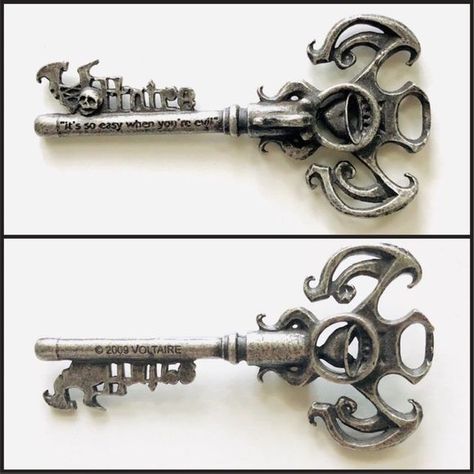 Designed by Voltaire and crafted by Alchemy Gothic, this stunning key pendant has been spotted around Voltaire's neck for a few years. He wears it on the cover of his country album, "Hate Lives in a Small Town", it is mentioned in the song, "This Sea" on his album "To the Bottom of the Sea" and most recently, it appeared as a mighty weapon of great strength in the on-line role playing game AdventureQuest Words (though much bigger of course!). University Teacher, Gothic Ornament, Alchemy Gothic, Bottom Of The Sea, Gothic Design, Stand Up Comedians, Role Playing Game, Father Figure, Key Pendant