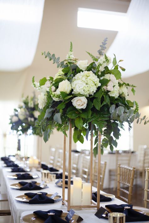 White And Sage Centerpieces, Black And White Wedding Floral Arrangement, White And Green Centrepiece Wedding, White And Green Centrepiece, Tall White And Green Centerpiece Wedding, Green And White Flower Arrangements Tall Centerpiece, Skull Wedding Decorations, Top Table White Flowers, Wedding Top Table Flowers