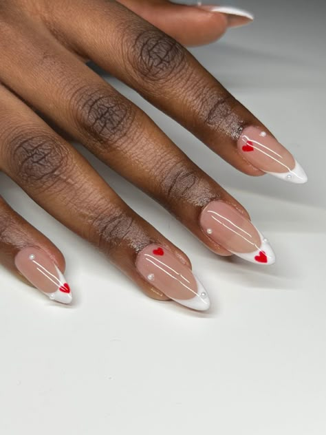 #almondnails #valentinesdaynails #frenchnails #nailart #naildesign #nailinspiration #nailinspo💅🏻 #nailsofinstagram #fashion #ignails Elegant Heart Nails, Almond Acrylic Nails Heart Design, Almond Nails For Valentine's Day, Oval Nails Designs Valentines, Red Wine Almond Nails, Red Nail Designs Almond, French Heart Nails, Feb Nails Valentines Day, French Tip With Heart