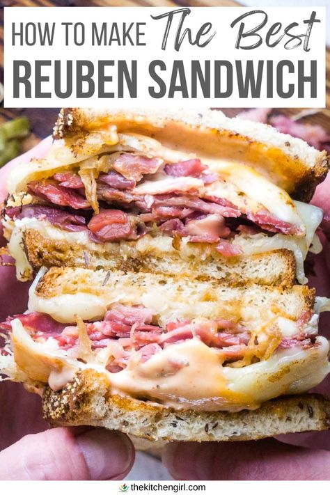 image of person's hands holding a stacked, saucy Reuben sandwich. The title text overlay at the top of image that says "How to make the best Reuben sandwich" Ruben Sandwich Recipe Best, Corned Beef Sandwich Ideas Rye Bread, Corned Beef Brisket Sandwich, Best Reuben Sandwich Recipe, Homemade Reuben Sandwiches, Ruben Recipe, Russian Dressing Recipe Reuben Sandwich, Ruban Sandwich Recipes, Ruben Sandwich Recipe