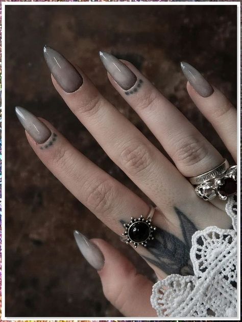 If you're looking for a way to add a little edge to your look, Goth stiletto nails are perfect! These nails are designed with a long, thin blade on one end and a pointy, black stiletto on the other. They are perfect for a Goth look and can be paired with a black dress or clothing to create the perfect look. Dark October Nails, Grey Gothic Nails, Vampire Ombre Nails, Vampire Nails Gothic Aesthetic, Gothic Inspired Nails, Simple Witchy Nail Designs, Grey Goth Nails, Nail Art Gothic Dark Beauty, Gothic New Years Nails