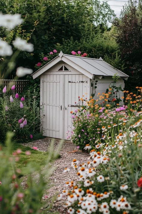 Transform your outdoor space with these 10 creative shed makeover ideas that truly elevate the aesthetics of your yard. Whether you want to create a cozy reading nook, a vibrant flower garden, or an entertaining space, there's something for everyone! These ideas will help you turn a simple shed into a gorgeous, functional spot that enhances your home’s appeal. Discover fun ways to integrate flowers, decorative pathways, or charming seating around your shed that will inspire jealousy from your neighbors! Shed Planting Ideas, Garden Shed Paint Ideas, Landscape Around Shed, Outdoor Shed Makeover, Decorative Pathways, Garden Shed Landscaping, Backyard With Shed, Shed Aesthetic, Shed Makeover Ideas