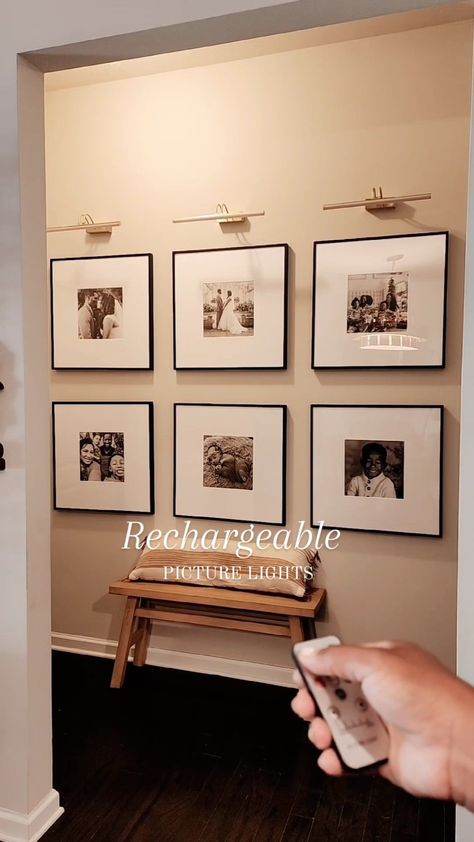 Wall Gallery With Lights, Over Picture Light, Hallway Gallery Wall With Lights, Frame Wall With Lights, Picture Frame With Light Above, Entryway Frame Wall, Family Wall Ideas Living Rooms, Scone Light Over Pictures, Decor Above Tv On Wall