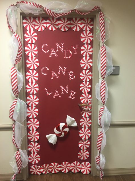 Peppermint Classroom Door, Peppermint Classroom Door Decoration, Decorated Classroom Doors For Christmas, Christmas Door Ideas For Apartments, Candy Cane Lane Bulletin Board, Candy Cane Door Decorations Classroom, Peppermint Door Decoration, Ginger Bread Door Decorating Contest, Hallway Christmas Decorating Ideas School