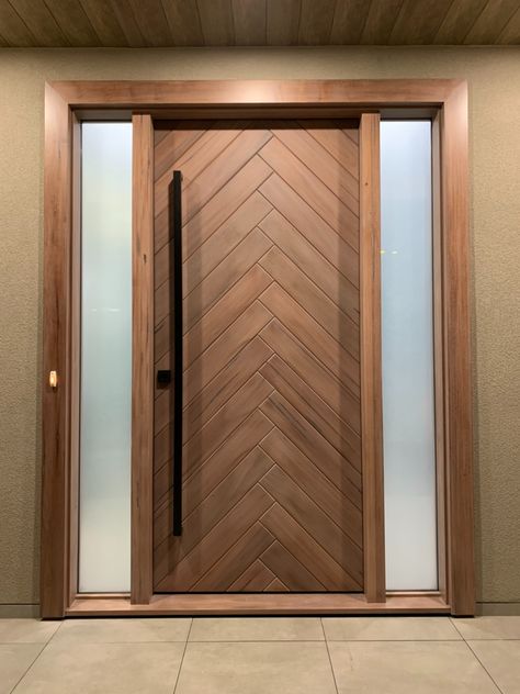 This eye catching modern front entry door is truly one of a kind, crafted from Medieval Walnut. Wood Front Entry Doors, House Main Door, Modern Entrance Door, Modern Entry Door, Modern Exterior Doors, House Main Door Design, Main Entrance Door Design, Front Door Design Wood, Wooden Front Door Design