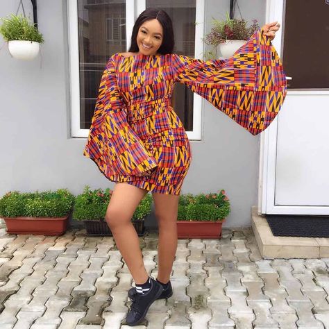 Mini Gown With Bell Sleeves Ankara Short Gown Styles With Sneakers, Nigerian Wedding Gowns, Classy Ankara Gown Styles, Ankara Playsuit, Simple African Dresses, Latest Kente Styles, Short Gown Ankara Styles, Ankara Short Gown Dresses, Ankara Short Flare Gowns