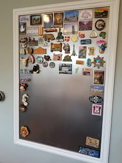 See how we DIY'd our own board to organize our travel magnet collection. It's pretty easy, you can make your own. Crafts and Projects Magnet Display, Travel Room Decor, Travel Magnets, Magnet Wall, Travel Themed Room, Souvenir Display, Travel Gallery Wall, Travel Room, Magnet Collection