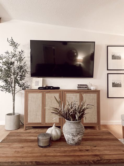 Tv On Wall Decor Ideas, Under Television Decor, 65” Tv On Wall, Minimal Tv Stand Decor, Living Room Wall Decor Sides Of Tv, Tv Buffet Decor, Tv Table Styling, Floor Tv Stand Decor, Modern Organic Living Room Tv