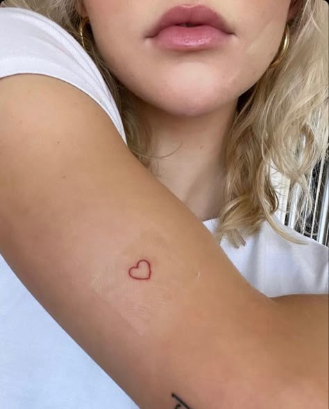 Hand Written Heart Tattoo, Tiny Red Heart Tattoo Hip, Heart Tattoo On Upper Arm, Small Red Tattoo Ideas For Women, Red Dainty Tattoos For Women, Heart Tattoo Simple Outline, Heart Tattoo Small Arm, Simple Red Heart Tattoo, Tattoo Idea Parents