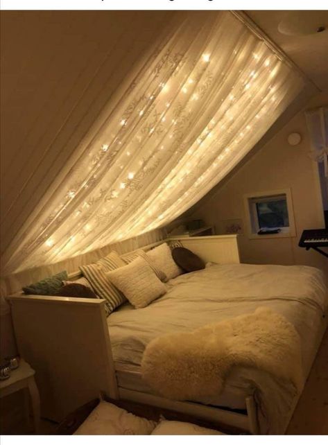 Curtain Over Bed With Lights, Canopy Bed Decorating Ideas Fairy Lights, Omega Nest, Slanted Ceiling Bedroom Ideas, Curtain Decor Ideas, Slanted Ceiling Bedroom, Bed Nook, Canopy Bed Frame, Hangout Room