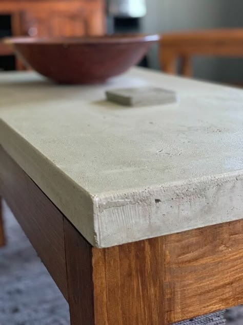 Stylish yet rugged, but beautiful coffee table in just a few steps!!Here is how I made my concrete coffee table, First make a mold out of milamin wood. The size is up to you. This one is 500mmx1000mmx45mm. Put silicone inside along the edges. Before pouring the concrete make sure that the mold is very clean and level. Then spray cooking spray inside the mold, or you can use olive oil, just to prevent the concrete from sticking to the mold. This is just to show the reinforcement I us… Cement Table Top Diy Outdoor, Concrete Desk Top, Diy Outdoor Concrete Coffee Table, Concrete Top Coffee Table, Concrete And Wood Coffee Table, Making A Concrete Table Top, Concrete Table Top Diy, Concrete Coffee Table Living Room, Concrete Table Diy