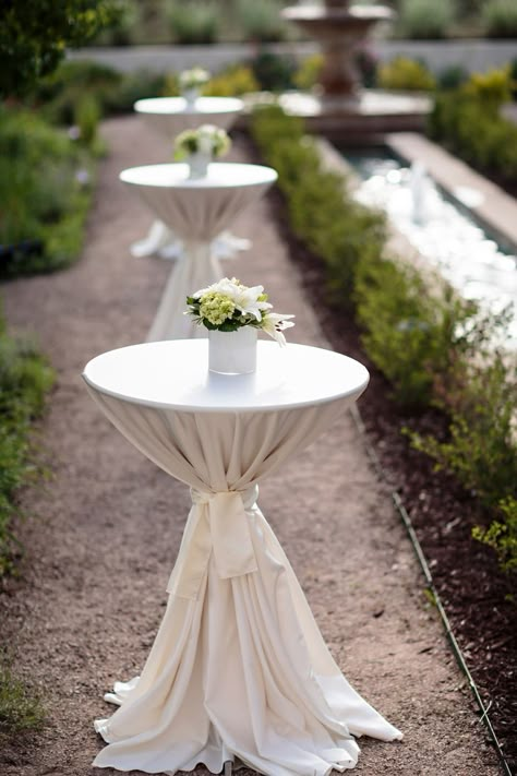 The cocktail tables were decorated with small centerpieces of lilies and hydrangea for a simpler reflection of the reception centerpieces. Wedding Cocktail Table Decor, Wedding Cocktail Table, Cocktail Table Centerpieces, Wedding Cocktail Tables, Cocktail Table Decor, White Centerpieces, Soft Pink Wedding, Popular Wedding Colors, Pink Wedding Colors