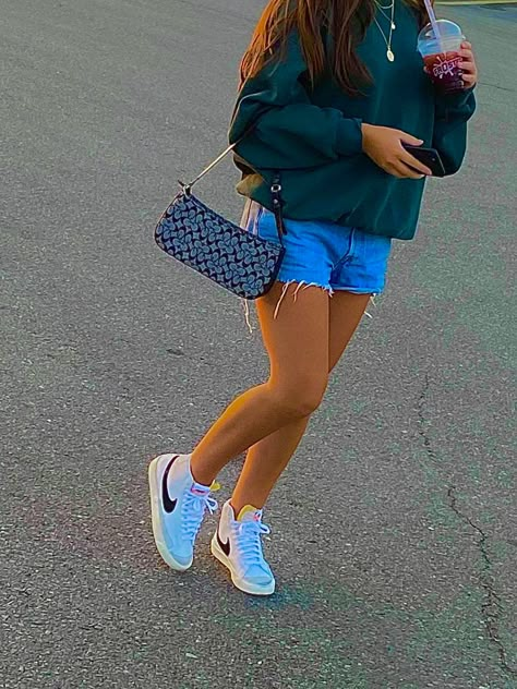 top thrifted, shorts are levis, purse guess, shoes Nike Mid Blazer 77 Hightop Sneakers Outfits, Nike Blazer Shorts Outfit, Summer Nike Blazer Outfits, Nike Blazer Outfits Summer, Outfits With Nike Blazer Mid 77, How To Style Blazers Shoes, Nike Blazers With Shorts, Nike Blazer Mid 77 Outfit Summer, Mid Blazer 77 Outfit