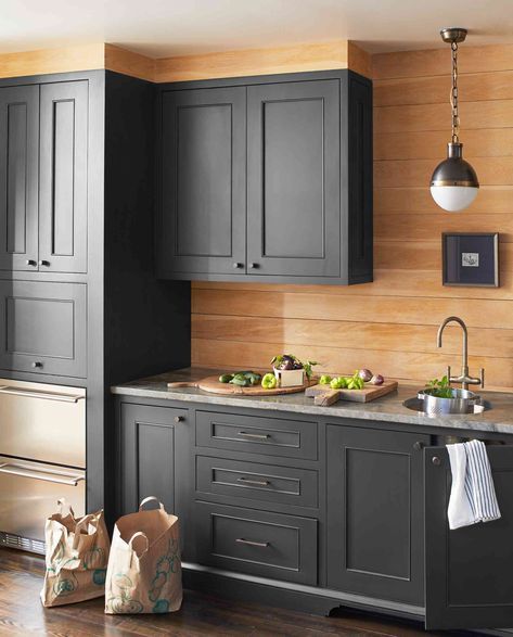 20 Best Kitchen Cabinet Paint Colors, According to Pros Cool Gray Kitchen Cabinets, Modern Cabinet Paint Colors, Benjamin Moore Graphite Cabinets, Light Gray Walls Dark Gray Cabinets, Best Grays For Kitchen Cabinets, Kitchen Spray Paint Cabinets, Behr Paint For Kitchen Cabinets, Folkstone Grey Kitchen Cupboards, Beyond Paint Kitchen Cabinets