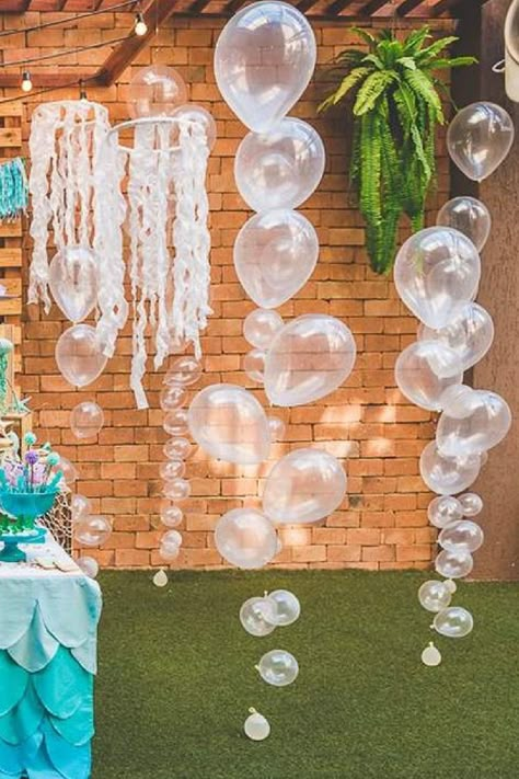 Diy Sea Themed Party Decorations, Undersea Theme Birthday Party, Clear Balloon Bubbles Under The Sea, Under The Sea Party For Adults, Water Decorations Party, Backyard Under The Sea Party, Diy Clear Bubble Garland, Under The Sea Birthday Party For Adults, Balloons From Ceiling Party Ideas