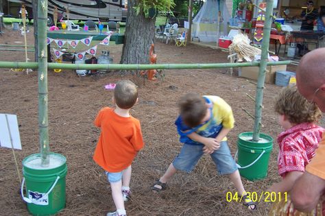 Limbo game-is a must have at a luau! Quickcreted bamboo poles into buckets; drilled holes fitted with small sticks of bamboo to hold the pole to go under. Limbo Game, Spring Carnival, Bamboo Poles, Luau Theme Party, Hawaiian Birthday, Luau Theme, Tiki Party, Outdoor Activities For Kids, Diy Games