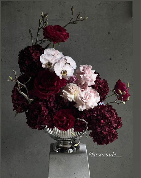 Dark Academia Floral Arrangements, Dark And Moody Wedding Florals, Dark And Moody Flowers, Red Hydrangea Centerpiece, Red And Purple Table Decorations, Dark Pink Flower Arrangements, Dark Hydrangea Bouquet, Dark Moody Flowers, Deep Red Wedding Bouquet