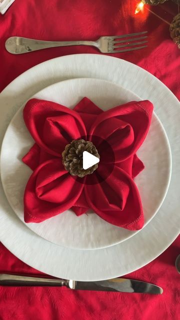 Manuela Mazzocco on Instagram: "✨Poinsettia Napkin Fold✨
Elevate your holiday gatherings with a touch of seasonal charm by incorporating the enchanting Poinsettia Napkin Fold into your Christmas dinner table decor
Find this and several more napkin folds in my website. Link in profile. DM/comment for more 
#napkinfold #tutorial #howto #napkin #tabledecor #holidaytable" Napkin Folding Ideas With Flowers, Diamond Pocket Napkin Fold, Napkin Folding With Greenery, Cloth Napkins Folding With Ring, Poinsettia Napkin Folding, Napkin Folding Ideas In Bowl, Christmas Decor Ideas For Dinner Table, Christmas Dinner Napkin Ideas, Lotus Napkin Fold