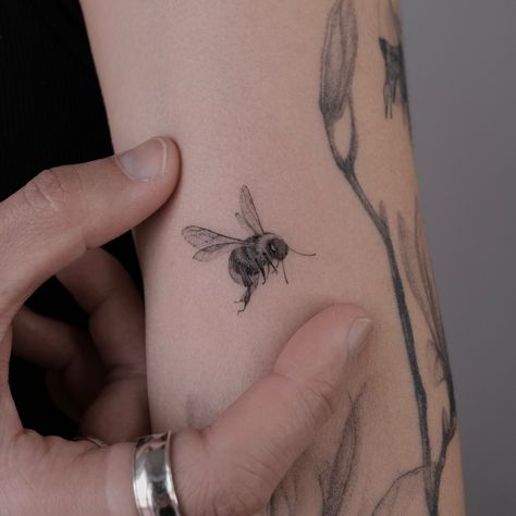 Micro realistic bee 🐝 Actually, I have a large collection of tattoos with bees in different poses, but I’ll never get tired of making such babies. So, who will be next? :) Booking link in my BIO 💌 Beekeeper Tattoo, Tattoos With Bees, Bees Tattoo Ideas, Carpenter Bee Tattoo, Bee Hand Tattoo, Bee Tattoo Men, Bumble Bee Tattoo Design, Realistic Bee Tattoo, Dainty Bee Tattoo