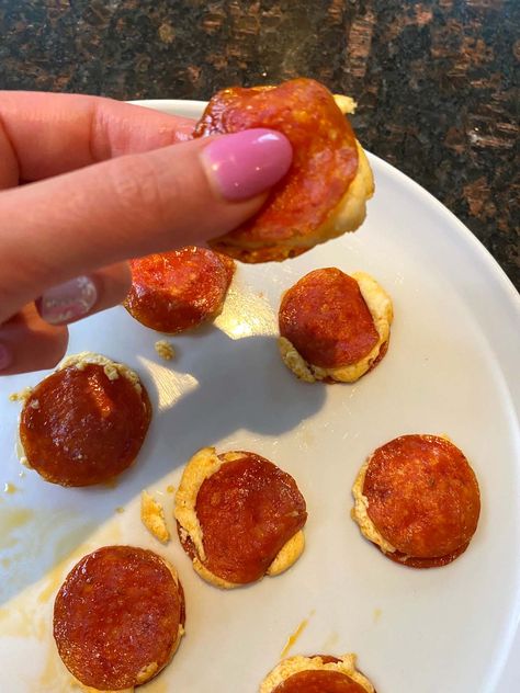 These Pepperoni Cream Cheese Bites In Air Fryer are such an easy appetizer! Just 2 ingredients for a low-carb, tasty snack or starter. Air Fryer Pepperoni Cream Cheese Bites You'll love how easy it is to make these yummy pepperoni bites. Just grab some pepperoni and cream cheese for a keto-friendly appetizer that everyone will enjoy. The air fryer perfectly cooks these crispy pepperoni slices sandwiched with smooth cream cheese. These scrumptious bites are great for a quick and easy snack. Or Crunchy Cream Cheese Pepperoni Bites, Baked Pepperoni Cream Cheese Bites, Baked Pepperoni And Cream Cheese, Pepperoni Bites Appetizers, Pepperoni Cream Cheese Rolls, Keto Cheese Sticks Air Fryer, Pepperoni And Cream Cheese Bites, Pepperoni Cream Cheese Bites, Air Fryer Pepperoni Chips