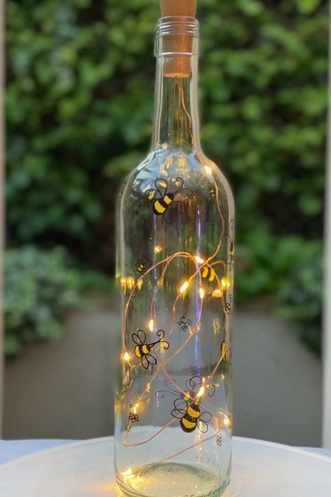 Hand Painted bottle with fairy light in Bumble Bee Design, perfect as a personalised gift for any occasion (especially with #mothersday right around the corner!) or as home décor to brighten any room. Each piece by Stephanie Designs is upcycled with care, all the way down to the recycled paper used for packaging, with sustainability and quality at the focus of every item sent. #giftsforher #sustainablegifting Crafting Workshop, Recycle Bottle, Bottle Fairy Lights, Painting Bottles, Jars Ideas, Light Up Bottles, Hand Painted Bottles, Upcycled Home, Painted Bottles