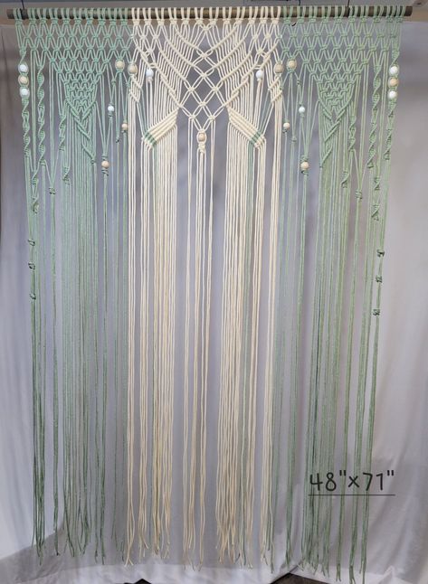 Beautiful handmade boho macrame curtain that can used as a wedding backdrop and/or door curtain.🖤  This can be customized in color and size.  If your size needed is not listed just message me.  This listing shows a 2 color light sage and natural cord combination with white and natural wood beads and a dark walnut stained dowel that measures 35.5" wide and 74" long.    This  listing includes an unfinished wood dowel along with natural and white wood beads and the complete macrame will be the one color which you pick off the color chart.  Just message me with any other customizations.  Please make sure your notifications are on so that I can message you with verification of details. Macrame Photo Backdrop, Macrame Door Curtain, Curtain Macrame, Boho Backdrop, Boho Style Decor, Photo Backdrop Wedding, Macrame Backdrop, Backdrop Wedding, Macrame Plant Holder