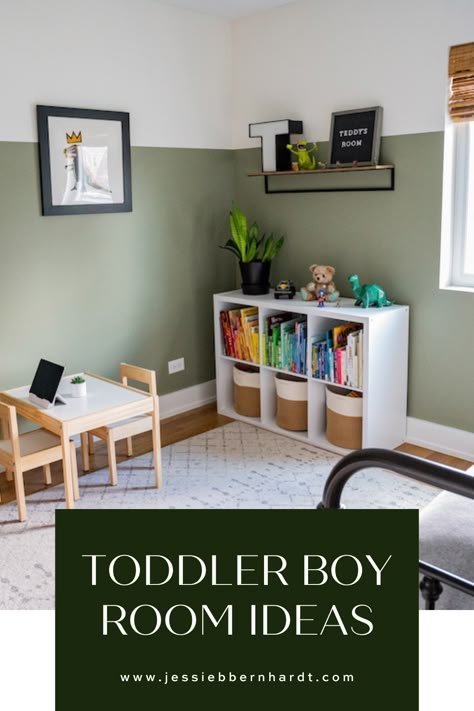 Sage green toddler boy's room with white bookshelf and books organized in rainbow color. Toddler Room Accent Wall Boy, Boys Toy Room Ideas, Kids Green Bedroom Ideas, Half Wall Paint Ideas Bedrooms, Toddler Boy Bedroom Furniture, Painted Boys Room, Gray Toddler Room Boy, Two Year Old Bedroom Boy Rooms, Little Boy Room Colors