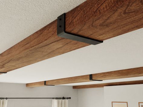 Wood Beam Lighting, Beam Brackets Metal, Decorative Ceiling Beams, Wood Beam Low Ceiling, Basement Beam Cover Ideas, Beam Separating Kitchen And Living Room, Faux Beams In Kitchen, Foam Beams Ceilings, Steel Beams Interior