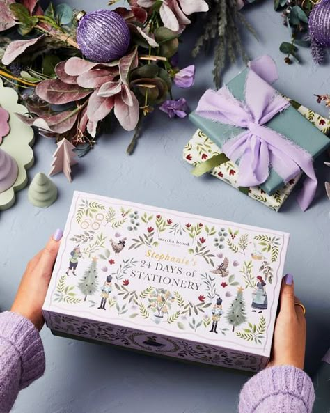 Martha Brook on Instagram: "Blown away by the reaction to our advent calendar, thank you! 💗 Did you know this year’s design has been inspired by the illustrated books from our childhood combined with the Twelve Days of Christmas?! 🌿 All twelve days are hidden on the lid - if you Zoom in, which can you see?! 👀 . Loads of you have signed up to our newsletter for early access on Wednesday THANK YOU! It’s not too late to do so - the link is in our bio! So excited… just 2 days to go! ✨✨✨" Christmas Box Packaging Design, Stationery Advent Calendar, Calendar Packaging, Personalized Gift Boxes, Advent Calendar Christmas, Present Design, Christmas Box Design, Box Ideas Design, Christmas Box Design Packaging