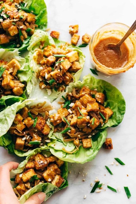 HELLO YUM. Firecracker Lettuce Wraps that are happily vegan - with crispy tofu bits, saucy brown rice noodles, and a creamy sesame sauce. #lettucewrap #vegan #tofu #veganlettucewrap #meatless #vegetarian | pinchofyum.com Tempeh Lettuce Wraps, Pf Changs Tofu Lettuce Wraps, Tofu Lettuce Wraps Pf Changs, Shredded Tofu Wrap, Lettuce Wraps Vegetarian, Meal Prep Tofu, Tofu Meal Prep, Korean Lettuce Wraps, Pf Changs Lettuce Wraps