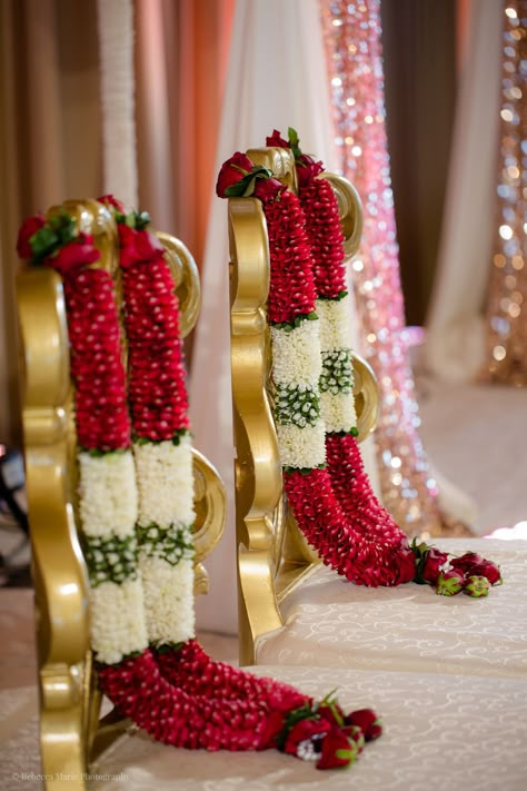 Aon Ballroom Wedding - Hindu celebration - Rebecca Marie Photography  Esha & Kapil's wedding at Aon Ballroom and Navy Pier in Chicago featured gorgeous traditional details, friends and family coming together, and a color palette of blush, bright pink, turquoise, magenta, and ruby. Hindu Wedding Mala, Flower Garlands For Wedding, Marriage Malai Design, Wedding Malai Design, Hindu Wedding Garland, Rose Malai, Varmala Indian Weddings, Garland Wedding Indian, Wedding Mala Rose