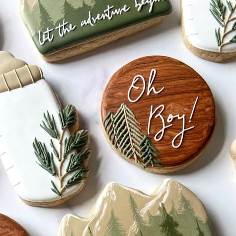 Jessica on Instagram: "🏔️While I often include a lot of variety in my orders, I also love the challenge of trying to put together an interesting set of cookies using only a few designs. The balance of these 3 together ended up really working out, and I couldn’t wait for the client to pick them up!  The intention was to try and keep all the designs on the simpler side, but I couldn’t help myself with that tree line idea. I love how they turned out🫶🏻  🌿Greenery Baby Bottle cutter available at HartworkCookieCo.com (link in bio) . . . . . . #babyshowercookies #cookiecutters #babyshower #letheadventurebegin #adventurecookies #mountaincookies #cookiedecorator #cookiedecorating #cookieart #royalicingcookies #royalicing #sugarcookies #decoratedsugarcookies #decoratedcookies #sugarcookiesofinst Pine Tree Cookies, Greenery Cookies Decorated, Let The Adventure Begin Cookies, Mountain Theme Cookies Decorated, Woodland Baby Shower Cookies, Pine Tree Royal Icing Cookies, Adventure Baby Shower Cookies, Woodsy Cookies Decorated, Adventure Awaits Baby Shower Cookies